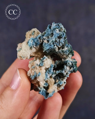 Blue Chalcedony specimen from Aurangabad, India shown in a hand