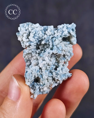 Blue Chalcedony specimen from Aurangabad, India shown in a hand