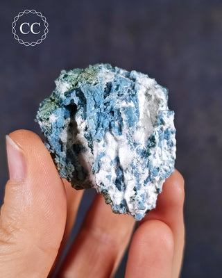 Blue Chalcedony specimen from Aurangabad, India shown in a hand