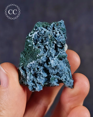 Blue Chalcedony specimen from Aurangabad, India shown in a hand