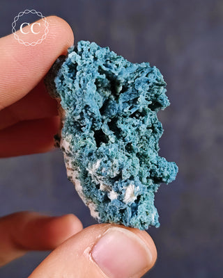 Blue Chalcedony specimen from Aurangabad, India shown in a hand