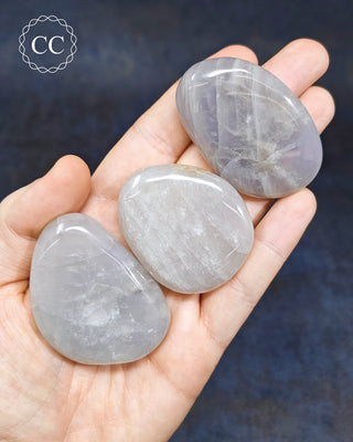 Blue Rose Quartz Palm Stones in hand