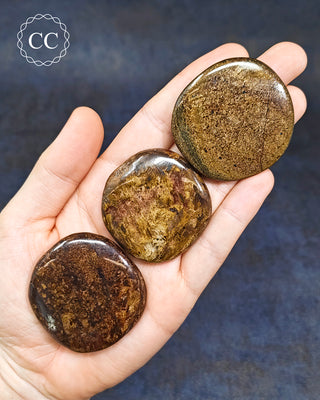 Bronzite Palm Stones in hand