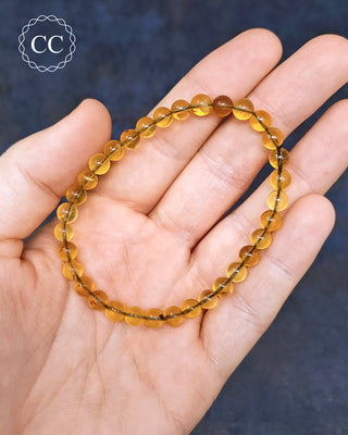 Burmese Amber 6mm Beaded Bracelet on hand