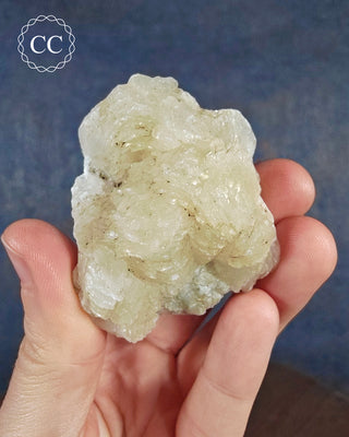 A hand holding a Calcite Specimen for Bulgaria 