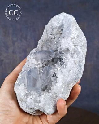 A hand holding a Celestite specimen from Madagascar