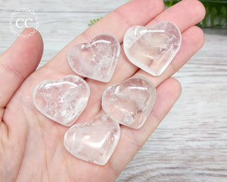 Clear Quartz Small Heart crystals in hand