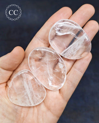 Clear Quartz Flat Palm Stones in hand