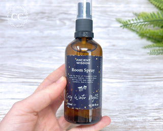 Cosy Winter Nights Room Spray 100ml bottle in hand