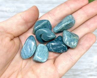 Dianite 'Blue Jade' Tumbled Crystals in hand