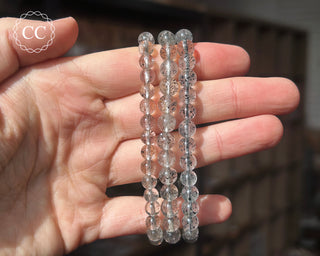 Disco Quartz 6mm Beaded Bracelets in hand