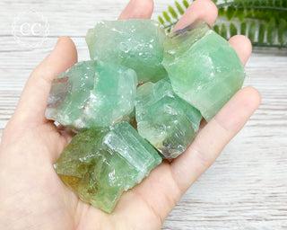 Emerald Green Calcite Raw Crystals in hand