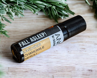 Fall Asleep Essential Oil Rollerball perfume on wooden table
