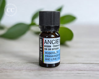 Focus and Drive Essential Oil bottle on a table