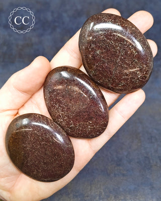 Garnet Chunky Palm Stones in hand