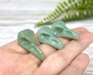 Green Aventurine raven Skulls in hand