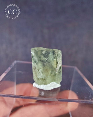 A rare etched Heliodor crystal from Padre Paraiso, Jequitinhonha, Minas Gerais, Brazil on a clear display box