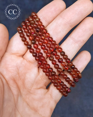 Hessonite Garnet Beaded Bracelets in hand