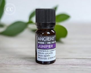 Juniper Essential Oil on a table