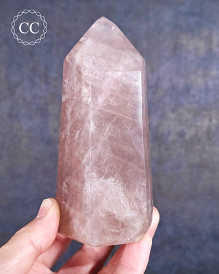 Large Rose Quartz Tower from Madagascar displayed in the hand