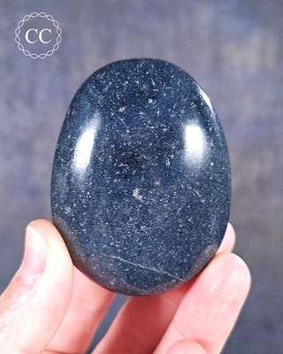 A hand holding a Lazulite Chunky Palmstone from Madagascar
