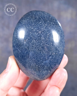 A hand holding a Lazulite Chunky Palmstone from Madagascar