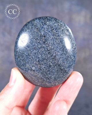 A hand holding a Lazulite Chunky Palmstone from Madagascar