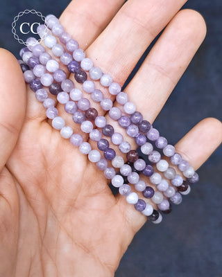 Lepidolite 5mm Beaded Bracelets in hand