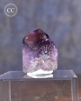 A Madagascar Amethyst Tower displayed on display box