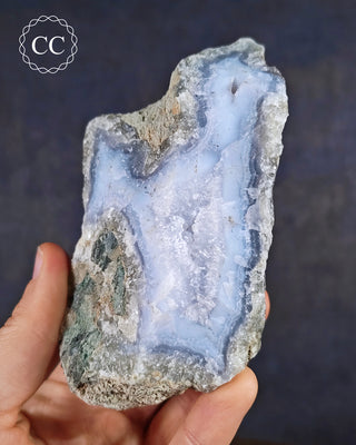 Natural Blue Agate/Blue Chalcedony specimen from Malawi, shown in a hand.
