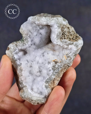 Natural Blue Agate/Blue Chalcedony specimen from Malawi, shown in a hand.