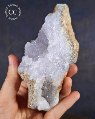 Natural Blue Agate/Blue Chalcedony specimen from Malawi, shown in a hand.