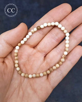 Fossil Mammoth Tooth Beaded Bracelets in hand