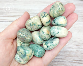 Mariposite Tumbled Crystals in hand