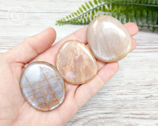 Peach Moonstone Palm Stones in hand