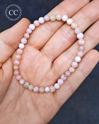 Peruvian Pink Opal Beaded Bracelet in hand