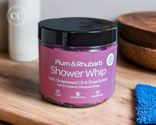Plum and Rhubarb Whipped Soap on bathroom counter