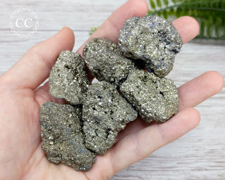 Pyrite Cluster Raw crystals in hand