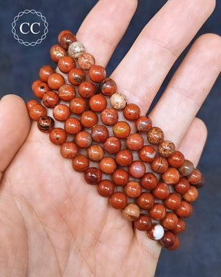 Red Jasper 6mm Beaded Bracelets in hand