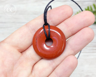 Red Jasper Donut Necklace in hand