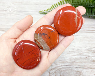 Red Jasper Palmstones in hand