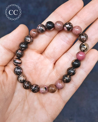 Rhodonite 8mm Beaded Bracelets in hand