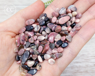 Rhodonite Crystal Chips in hand