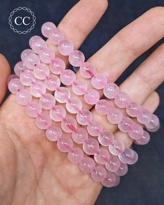 Rose Quartz 8mm Beaded Bracelets in hand