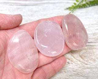 Rose Quartz Flat Palm Stones in hand