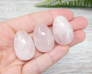 Rose Quartz Mini crystal eggs in hand