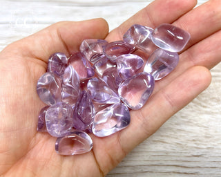 Rose de France Amethyst Tumbled Crystals in hand