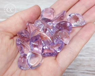 Rose de France Amethyst Tumbled Crystals in hand