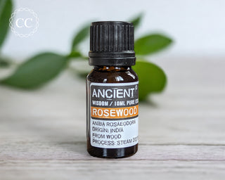 Rosewood Essential Oil on a table