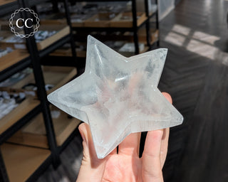 Satin Spar (Selenite) Star Bowl in hand on dark background